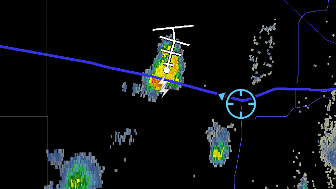 An irregular blob of blue, green and yellow splotches represents a small storm cloud on the Doppler radar image. Two white lightning strike icons show where the bolts hit.
